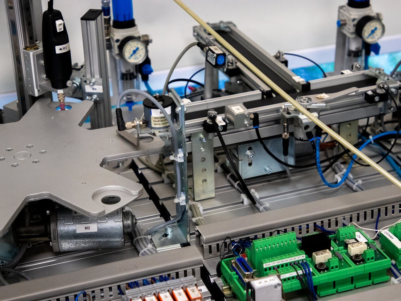 about-us-01 Close-up of advanced machinery showcasing robotic automation and precision engineering.